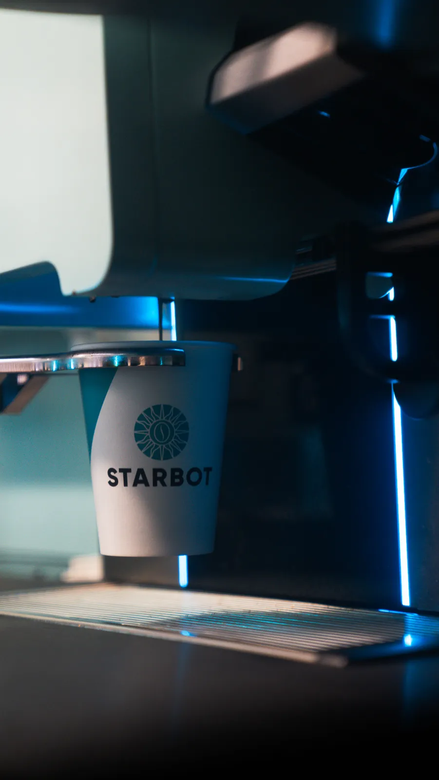 Espresso extracting into a cup inside the STARBOT kiosk