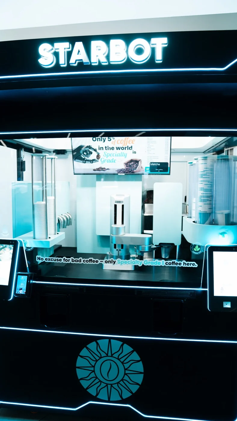 The STARBOT kiosk head on, showing the screen and collection hatch